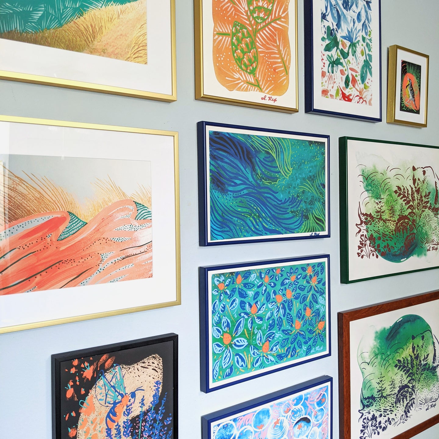 Gallery wall of custom-framed art prints by Seattle Taiwanese Artist Irene Rex